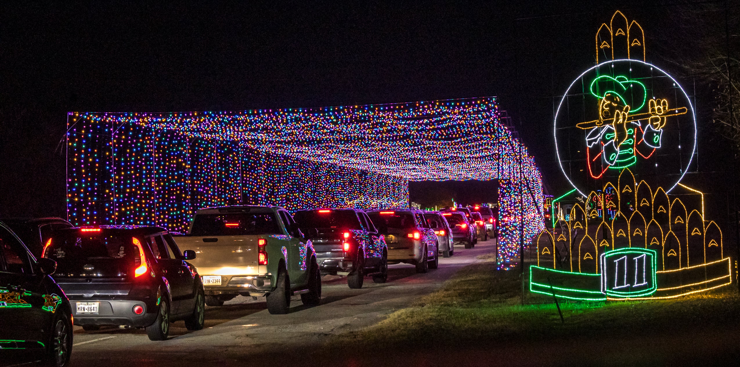 Cars entering the RGB Digital Tunnel at Lights of Joy in Branson