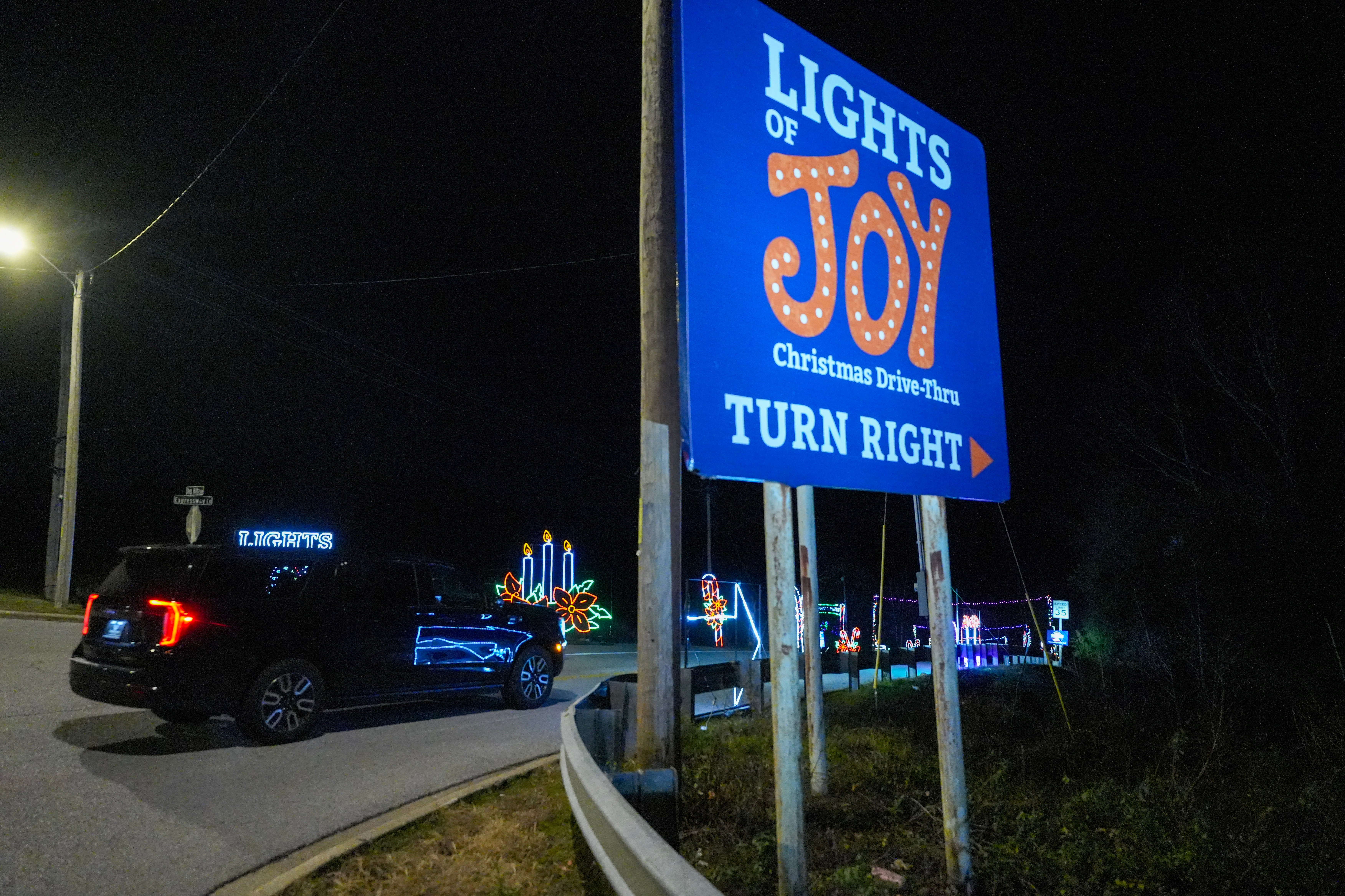 Lights of Joy turn right sign on Shepherd of the Hills Expressway in Branson