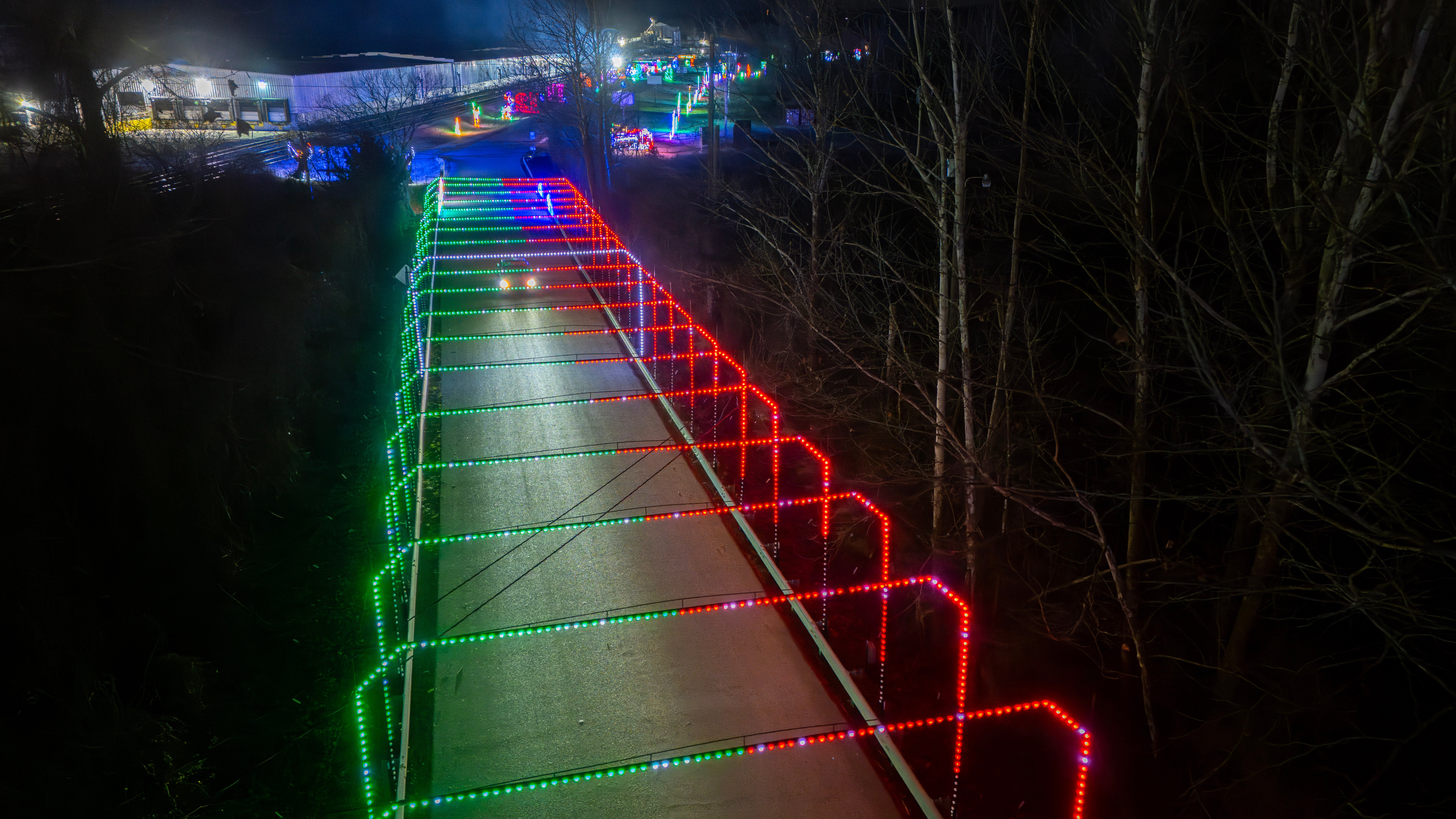 Glowing light tunnel over the drive at Lights of Joy Christmas Drive-Thru in Branson
