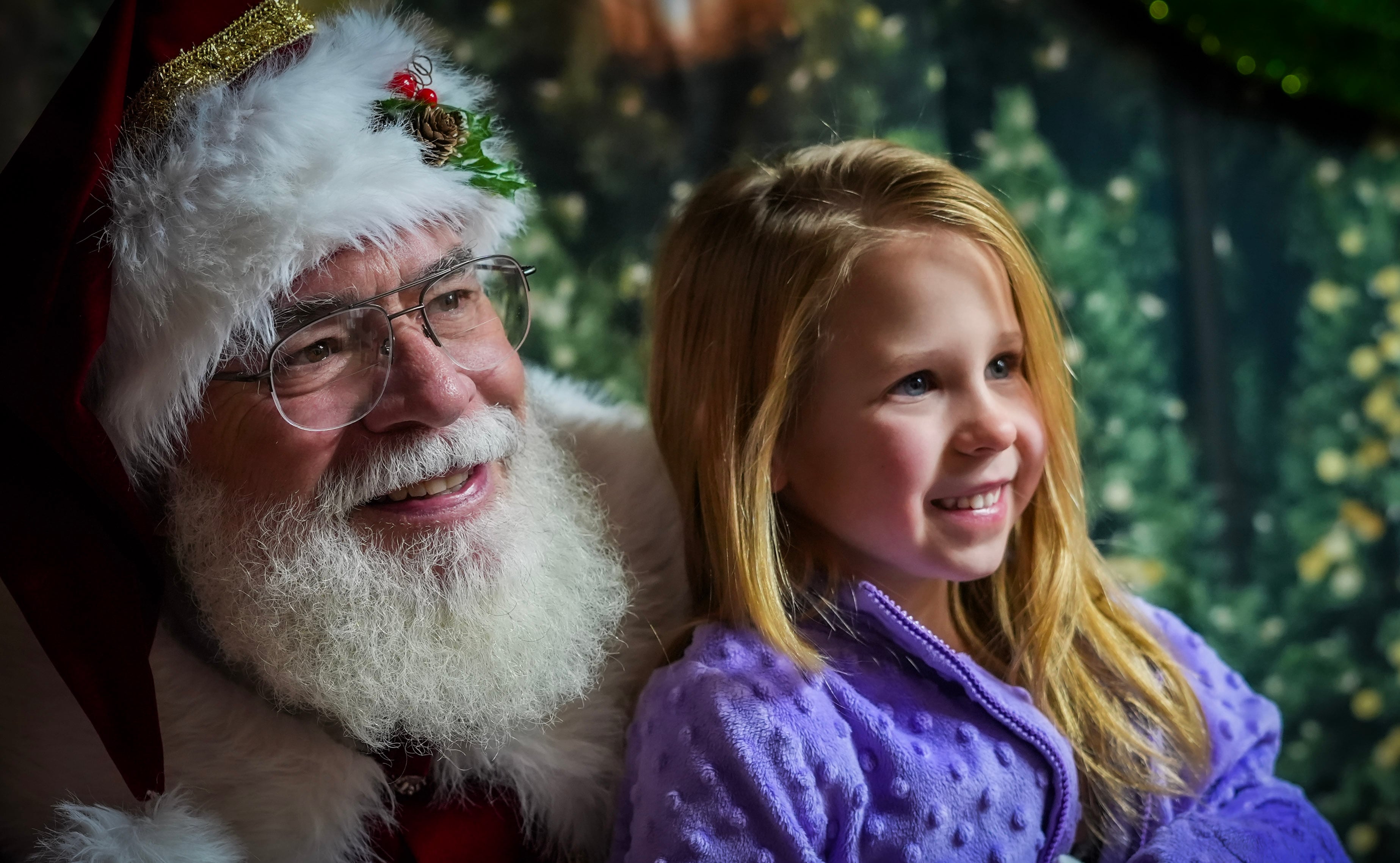 Little girl smiling with Santa on a Santa night in Branson, Missouri