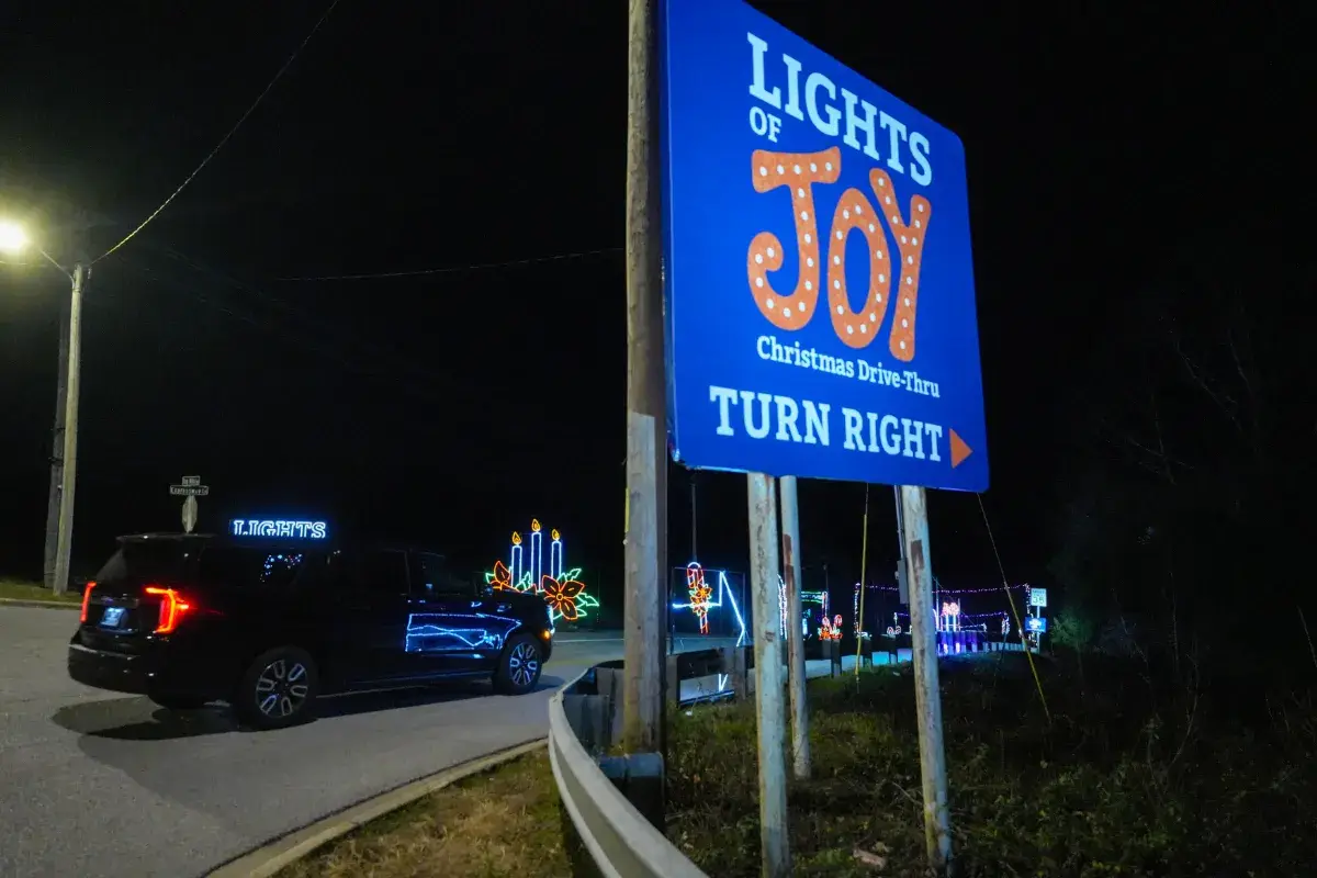 Lights of Joy turn right sign on Shepherd of the Hills Expressway in Branson